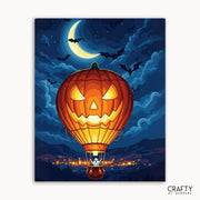 Halloween-themed artwork with a jack-o'-lantern hot air balloon against a night sky.