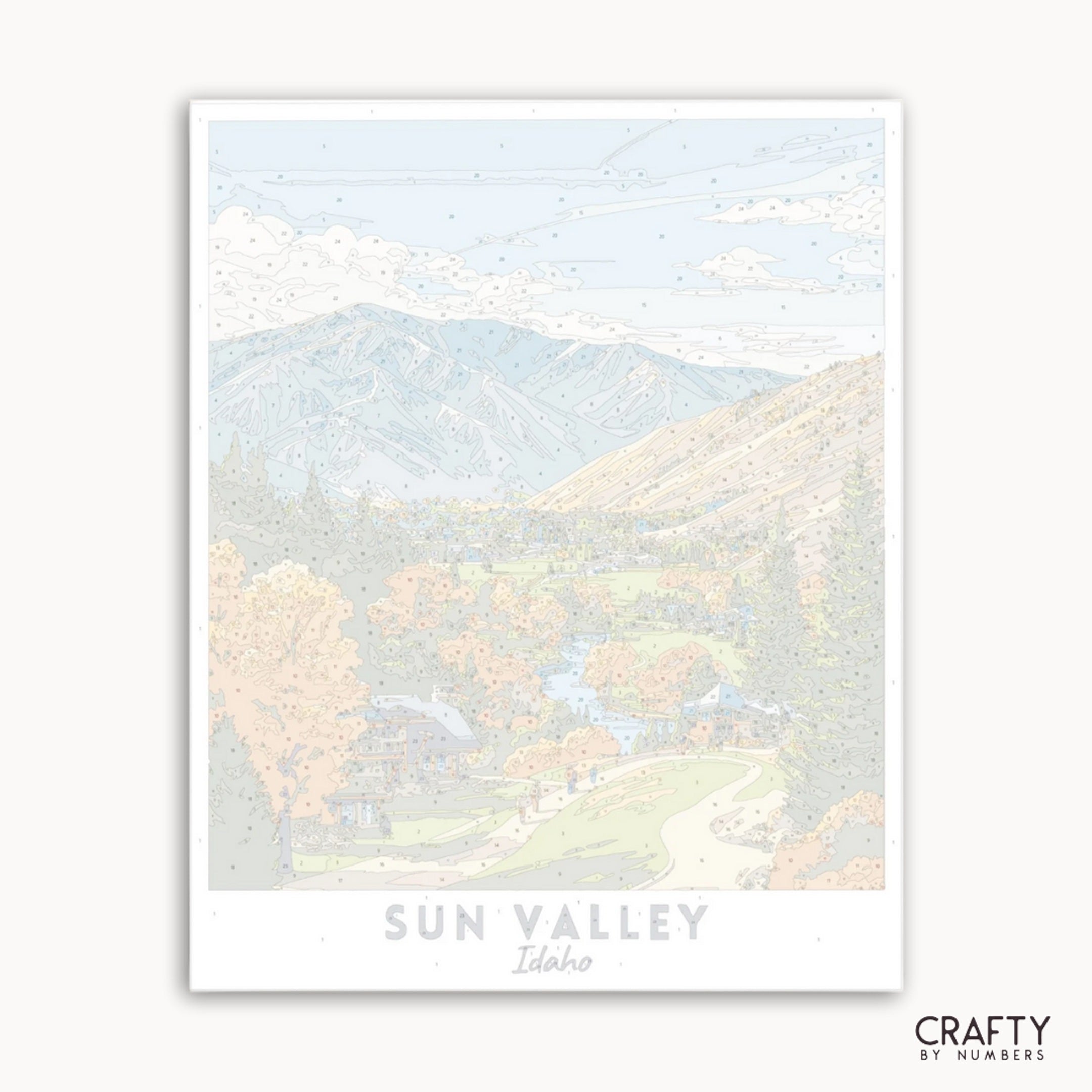 Art print of a mountain landscape with 'Sun Valley, Idaho' text and 'Crafty by Numbers' branding.