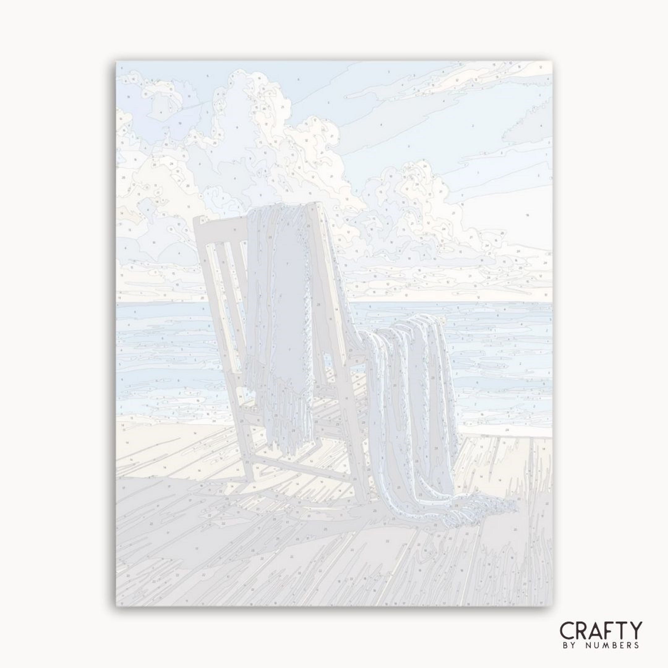 Beach scene with lounge chairs and sand, featuring the brand 'Crafty by Numbers'.