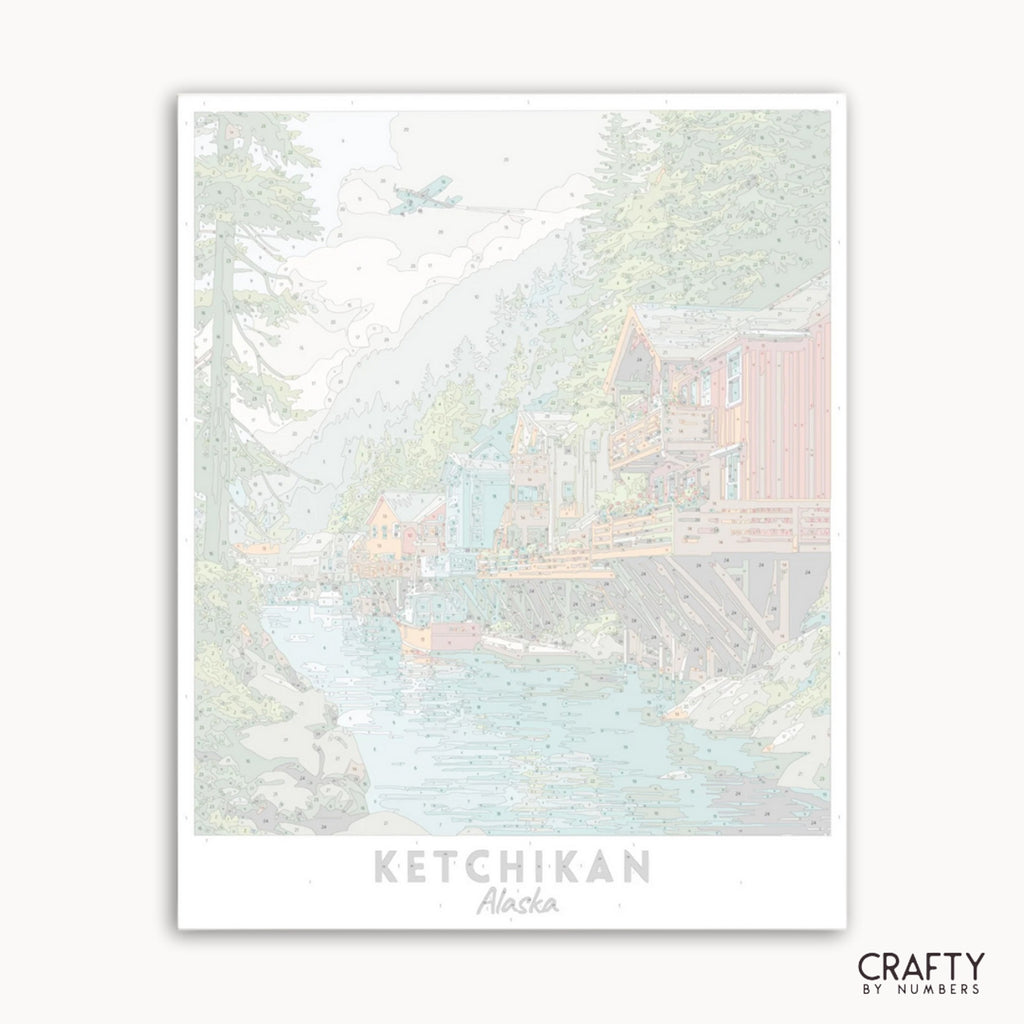 Illustration of a cabin in the woods with 'Ketchikan, Alaska' text and 'Crafty by Numbers' branding.