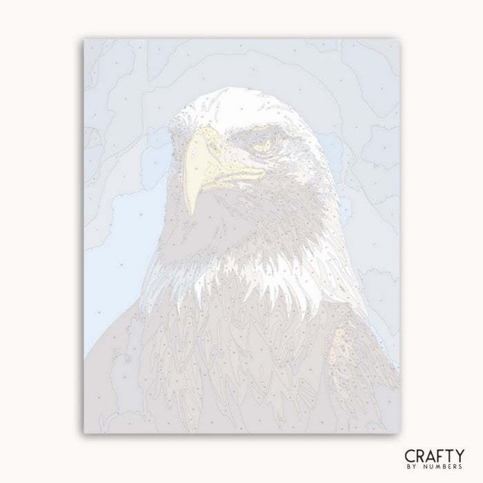 Holographic foil of an eagle on a light blue background with 'Crafty by Numbers' branding.