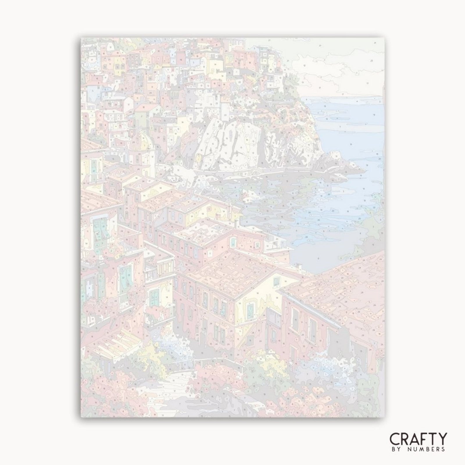 Art print of a coastal scene with houses and water, featuring the brand 'Crafty by Numbers'.