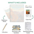 Painting kit components including a reference sheet, paint set, brushes, and detailed guide with Grand Canyon imagery.