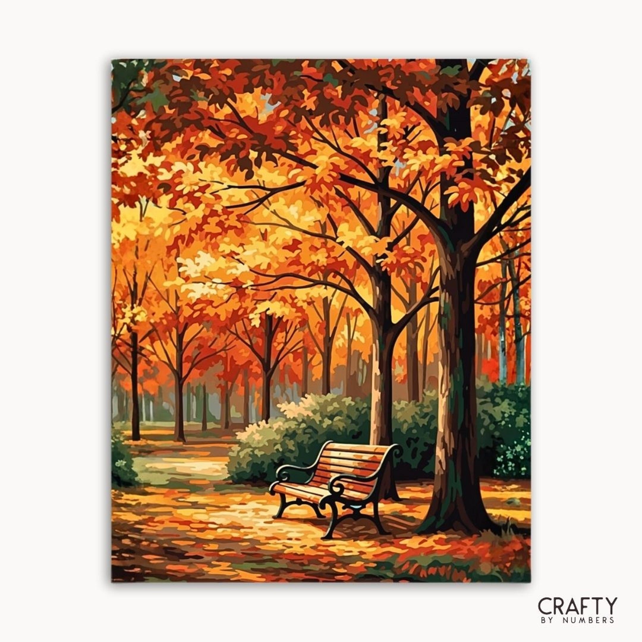 Painting of an autumn scene with trees and a bench, featuring the brand 'Crafty by Numbers'.