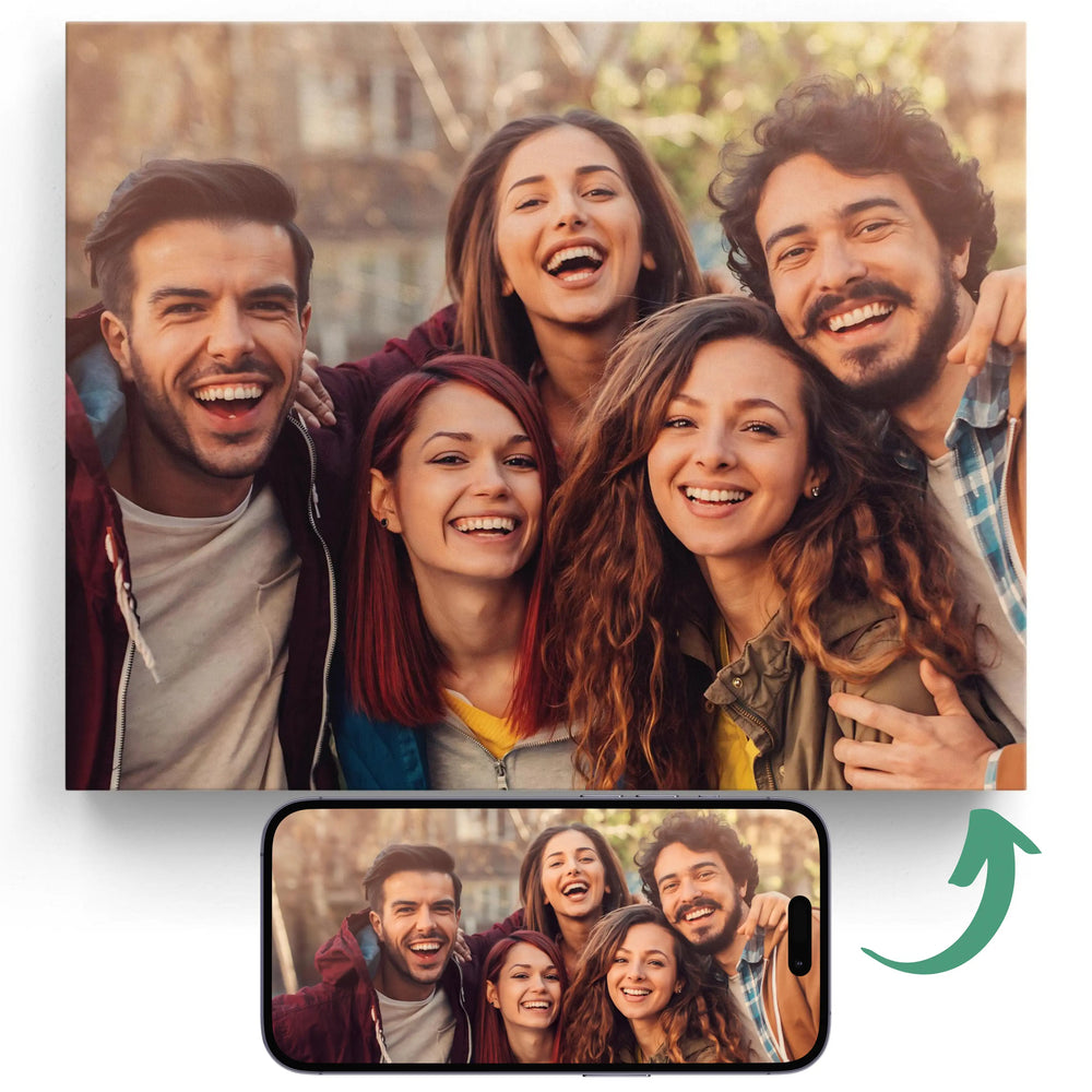 A canvas print of a group of people smiling, with a smartphone showing the photo being printed on it.