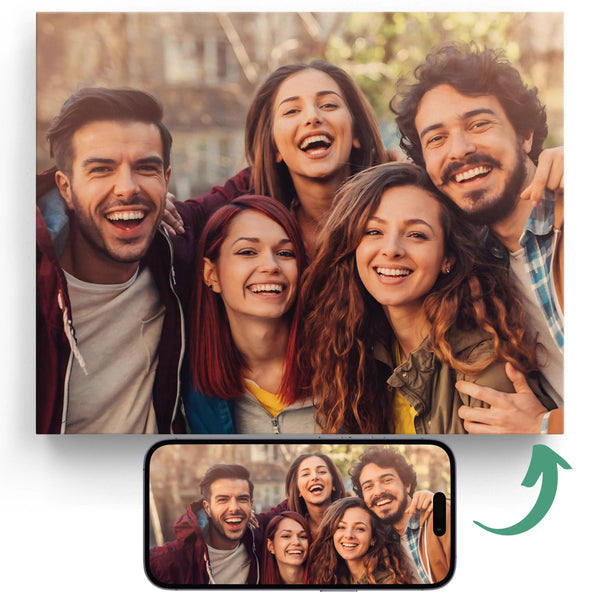 A canvas print of a group of people smiling, with a smartphone showing the photo being printed on it.