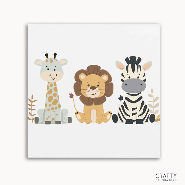 A paint by numbers kit featuring illustrations of a giraffe, a lion, and a zebra on a white background, with the Crafty by Numbers logo at the bottom.collection