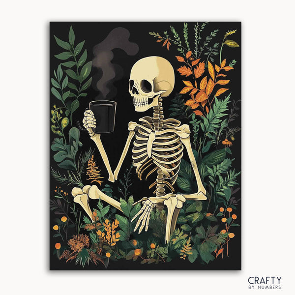 A paint by numbers kit depicting a relaxed skeleton holding a cup, seated amidst autumn leaves and foliage.