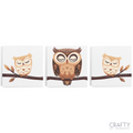 A set of three canvas paint by numbers kits with cartoon-style owls perched on branches.