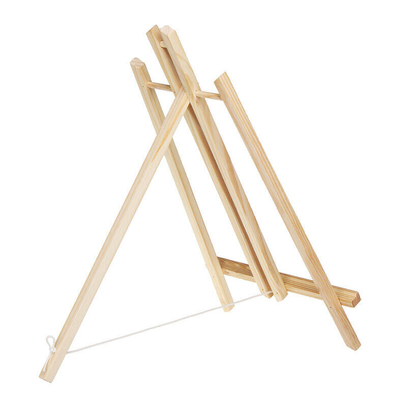 Premium Photo  Wooden easel photo stand tripod for photo with sea on  background