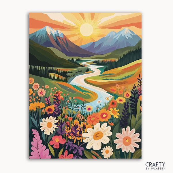 A paint-by-numbers kit canvas with a vibrant depiction of a sun-kissed field landscape, including colorful flowers and a mountain range in the background.