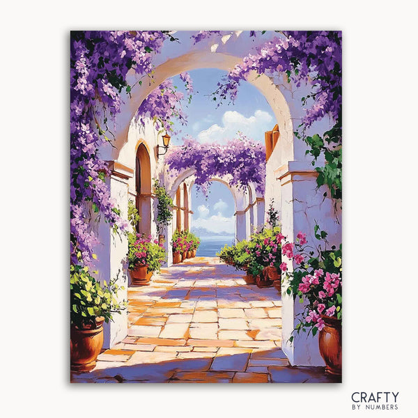 A paint-by-numbers kit image featuring a vibrant scene with Sunlit Arches, where white stone archways lead to a view of the ocean, flanked by purple bougainvillea and greenery.