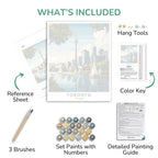 Artistic painting kit components including a poster of Toronto, reference sheet, brushes, paint set, color key, and detailed guide.