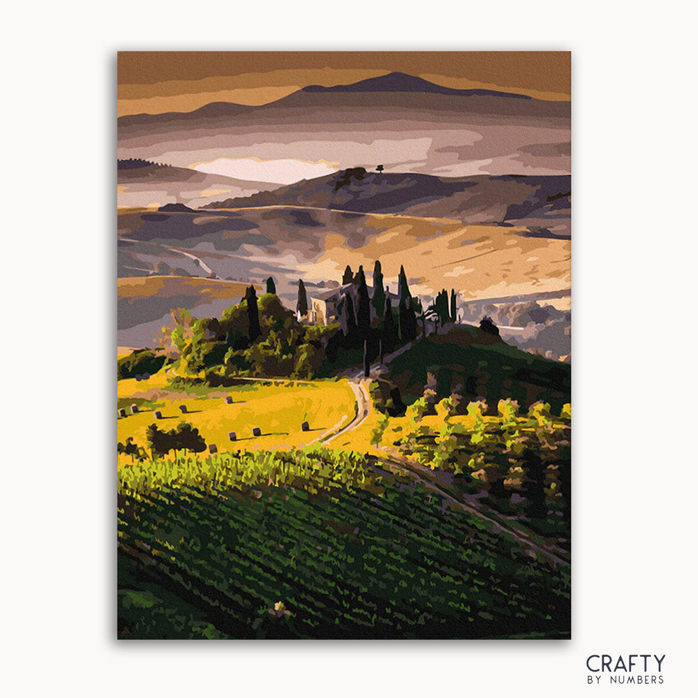 A painted depiction of a Tuscany landscape with green hills, blue sky, and cypress trees.