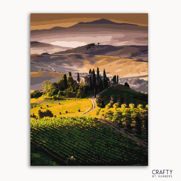 A painted depiction of a Tuscany landscape with green hills, blue sky, and cypress trees.