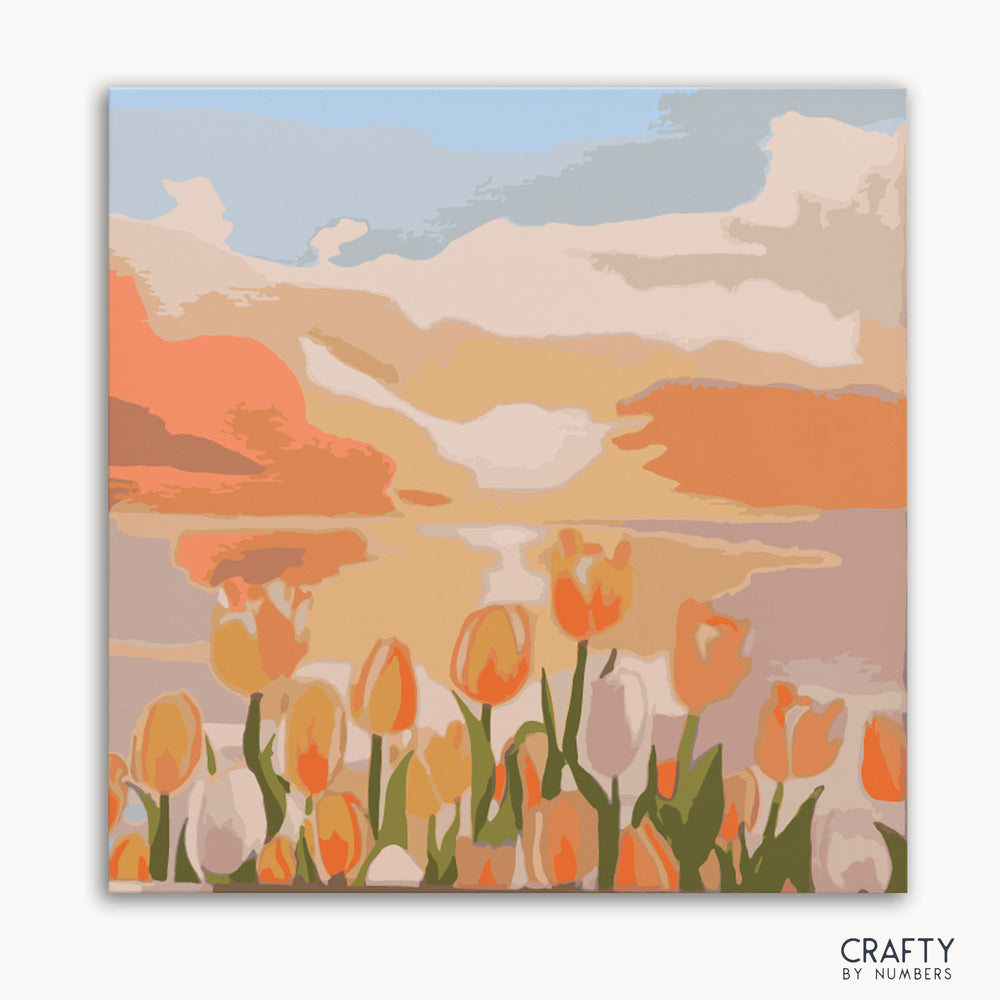 A painting kit representation of a tulip field at twilight with a colorful sky.