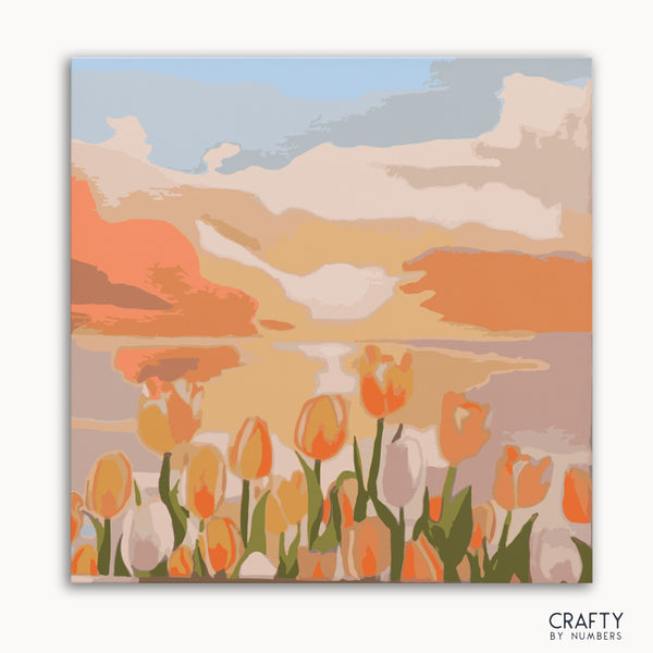 A painting kit representation of a tulip field at twilight with a colorful sky.