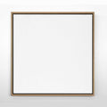 A framed canvas artwork with an oak wood frame, featuring a plain white surface.