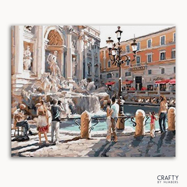 A paint-by-numbers kit depicting the Trevi Fountain with people in the foreground, a clear blue sky, and classic Roman architecture.
