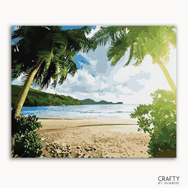 A paint-by-numbers kit depicting a beach scene with palm trees and a clear sky.