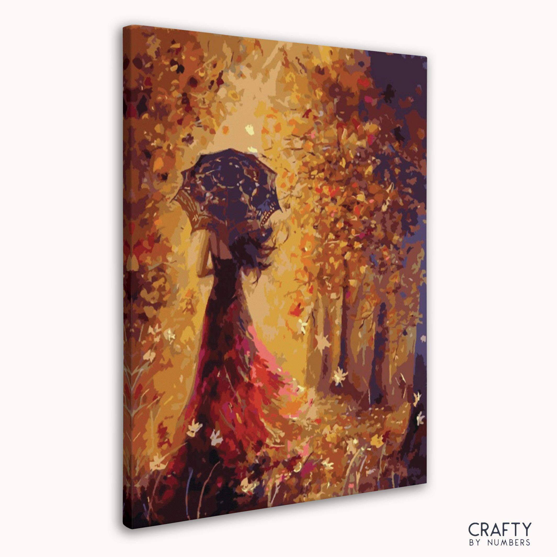 Close-up of paint by numbers canvas featuring woman in fall colors