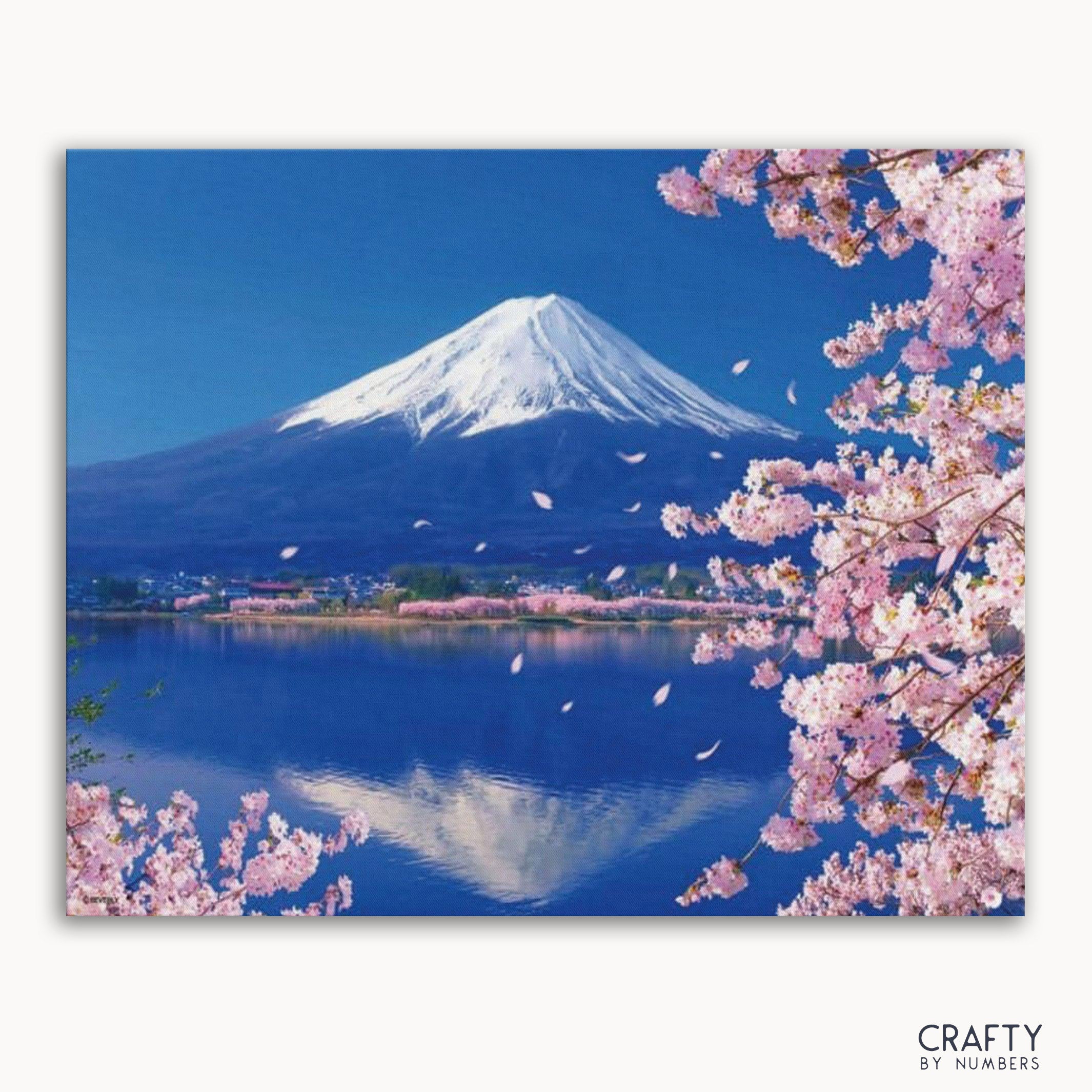 A paint by numbers kit image featuring a blossom lake view with a mountain in the background.