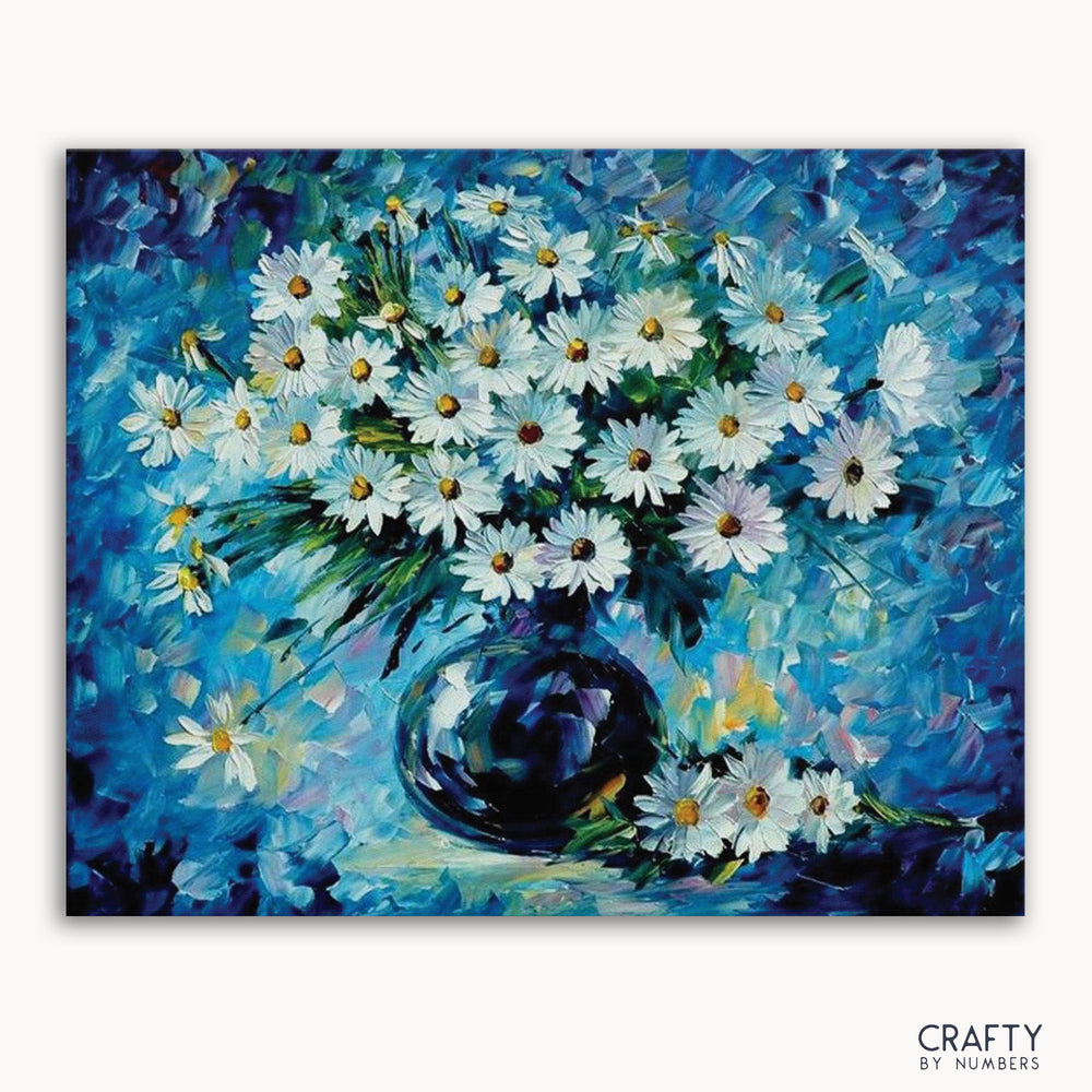 A paint-by-numbers kit image featuring a bouquet of daisies with blue petals in a dark vase, with the 'CRAFTY by NUMBERS' logo at the bottom.