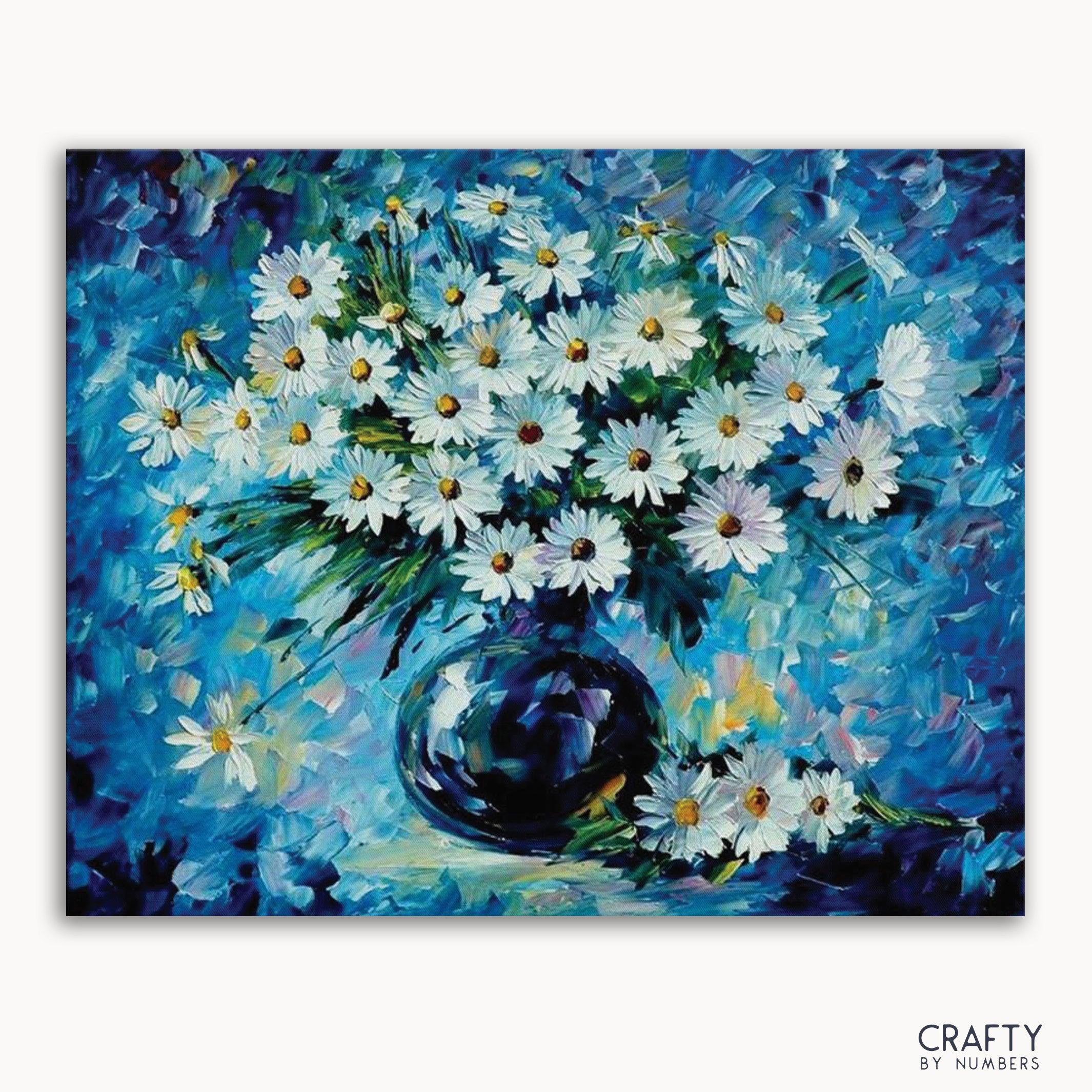 A paint-by-numbers kit image featuring a bouquet of daisies with blue petals in a dark vase, with the 'CRAFTY by NUMBERS' logo at the bottom.