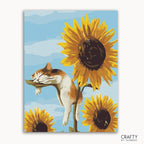 A paint-by-numbers kit image featuring a cat sleeping on a sunflower with a blue sky in the background, among multiple sunflowers.
