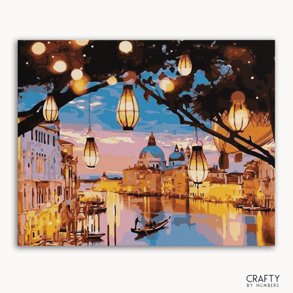 A paint-by-numbers kit depicting a vibrant cityscape with lights and a body of water, likely representing Venice.