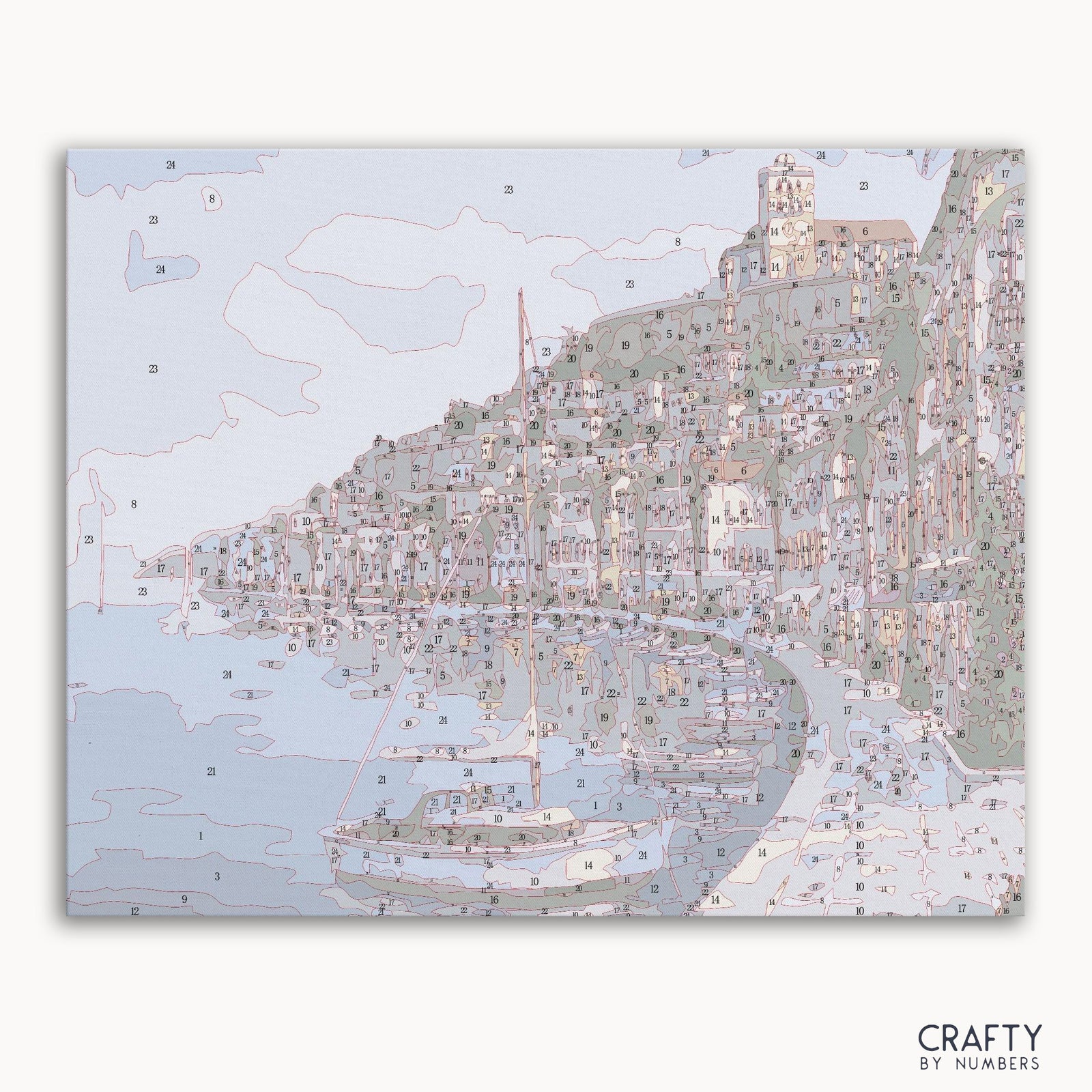 Dusky seaside town with waterfront buildings and a boat