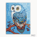 A paint-by-numbers kit image featuring a colorful mandala owl design on a framed canvas.