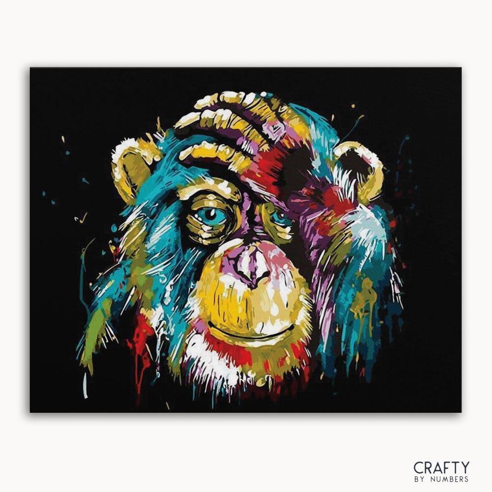 A colorful painting of a monkey with abstract patterns in multiple colors on a black background, with the text 'CRAFTY by NUMBERS' at the bottom.