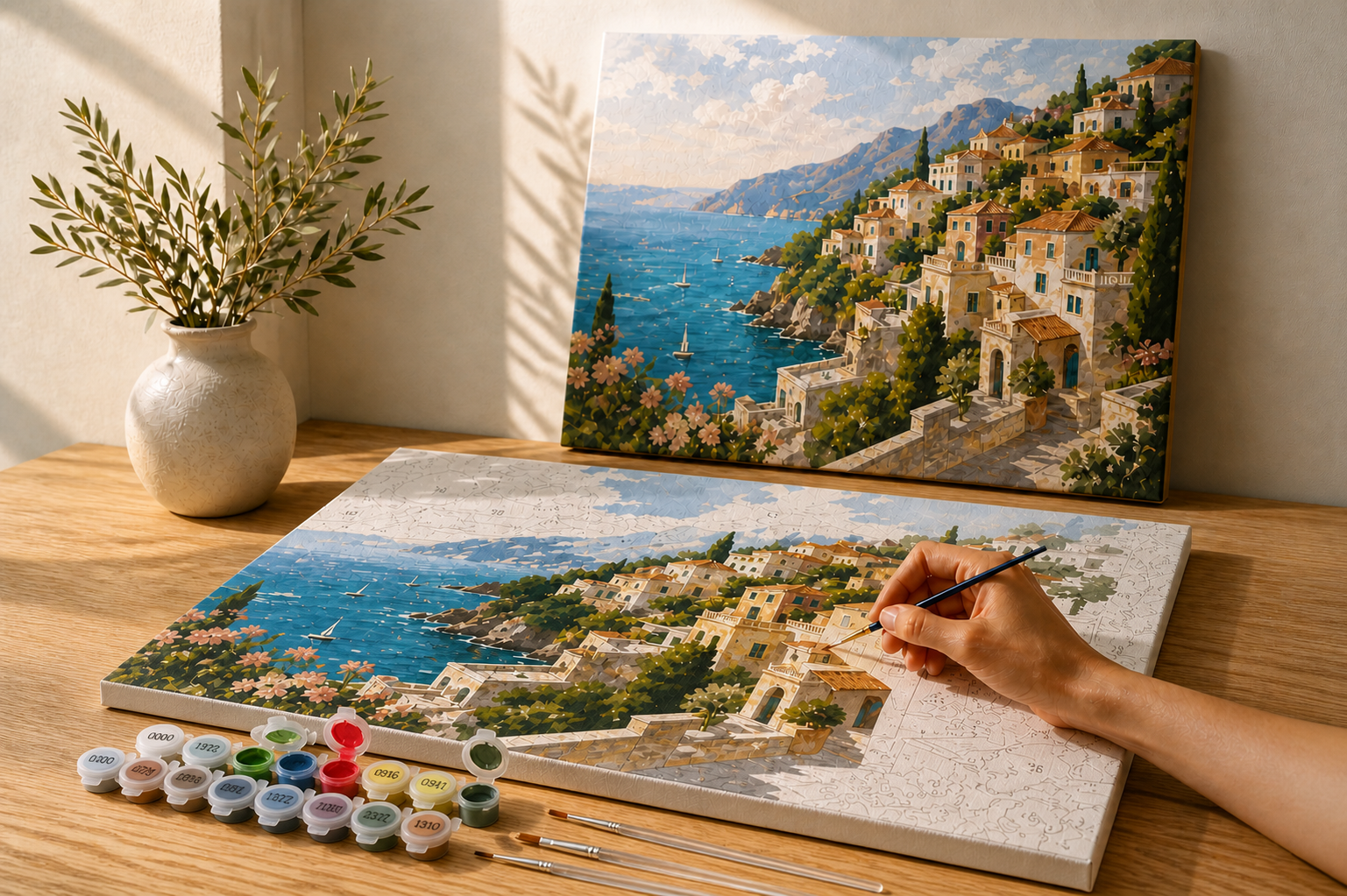 A partially painted Mediterranean paint-by-numbers canvas beside the finished artwork, with authentic numbered paint pot strips