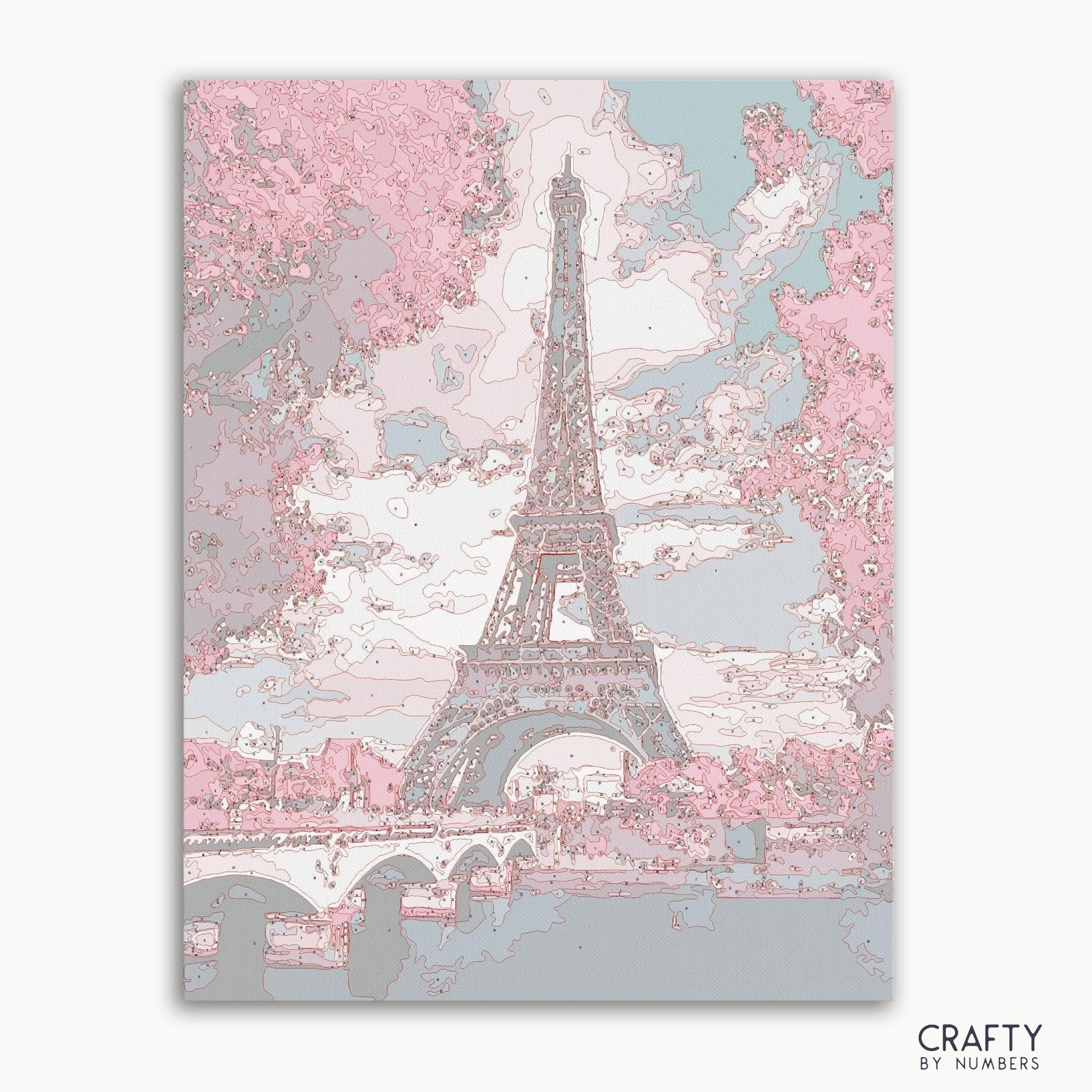 Kit de pintura por números de la Torre Eiffel en lienzo con paisaje detallado.