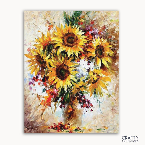 A paint-by-numbers kit image featuring a bouquet of sunflowers with vibrant yellow petals and green leaves, with numbers still visible on the canvas.