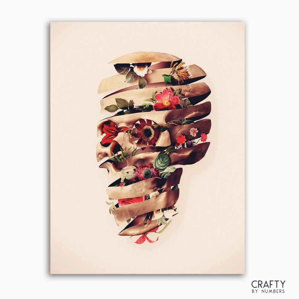 A paint-by-numbers kit image featuring a floral design arranged in the shape of a skull.