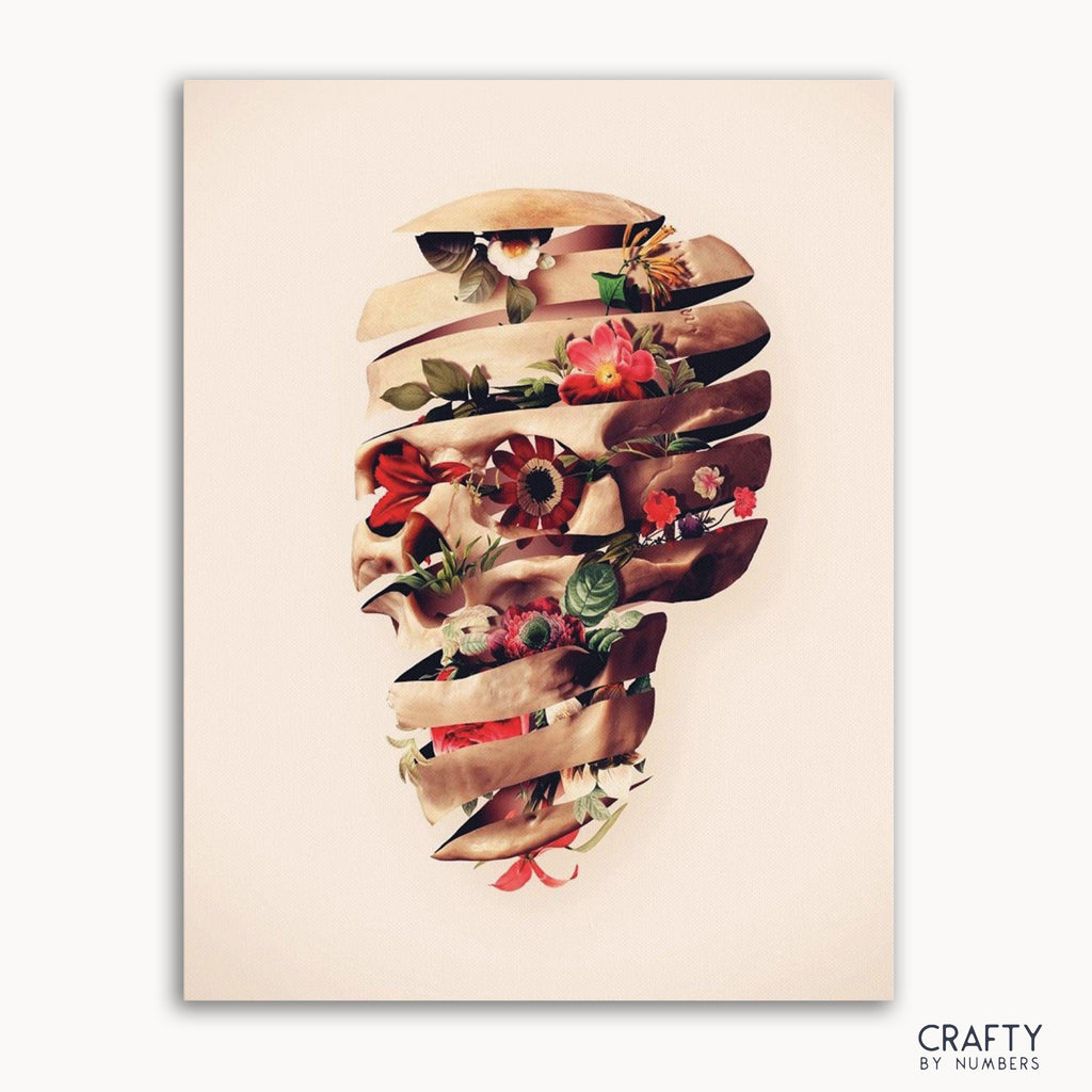 A paint-by-numbers kit image featuring a floral design arranged in the shape of a skull.