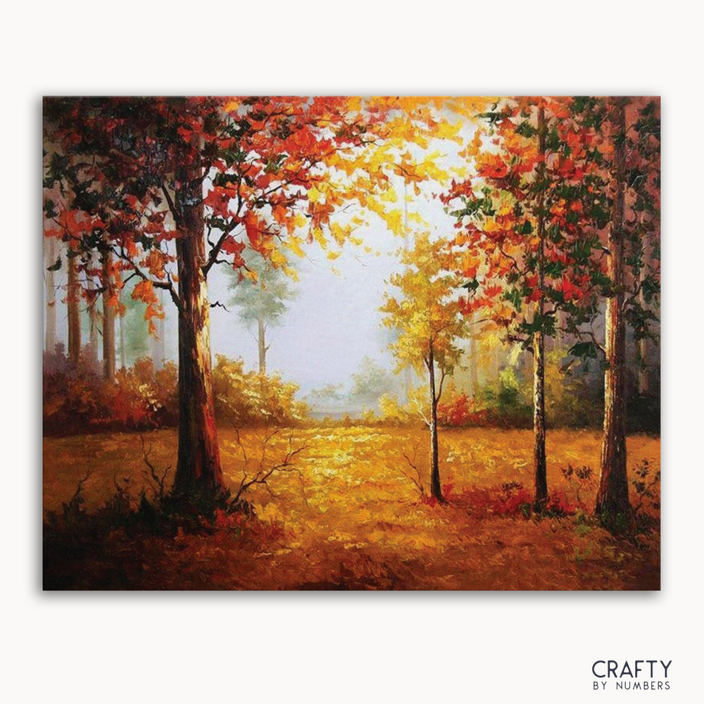 A paint-by-numbers kit depicting a forest scene in autumn with vibrant colored leaves and a misty background.