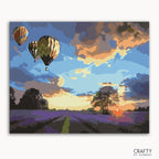 A paint-by-numbers kit image featuring a landscape with hot air balloons in the sky at sunset.