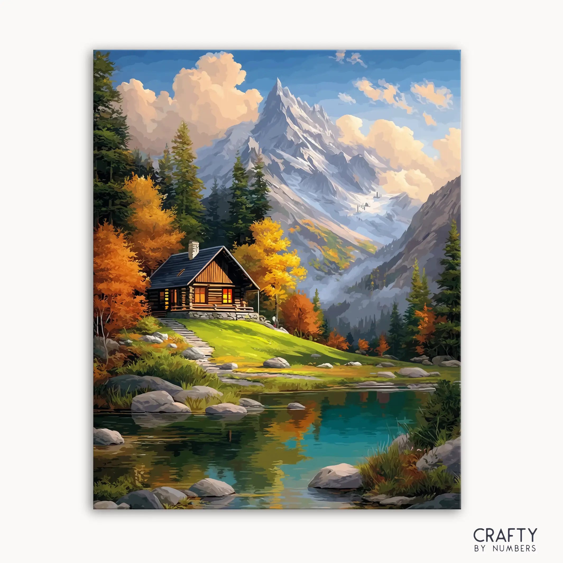 A paint by numbers kit depicting a cabin by a crystal-clear lake with autumn trees and mountains in the background.