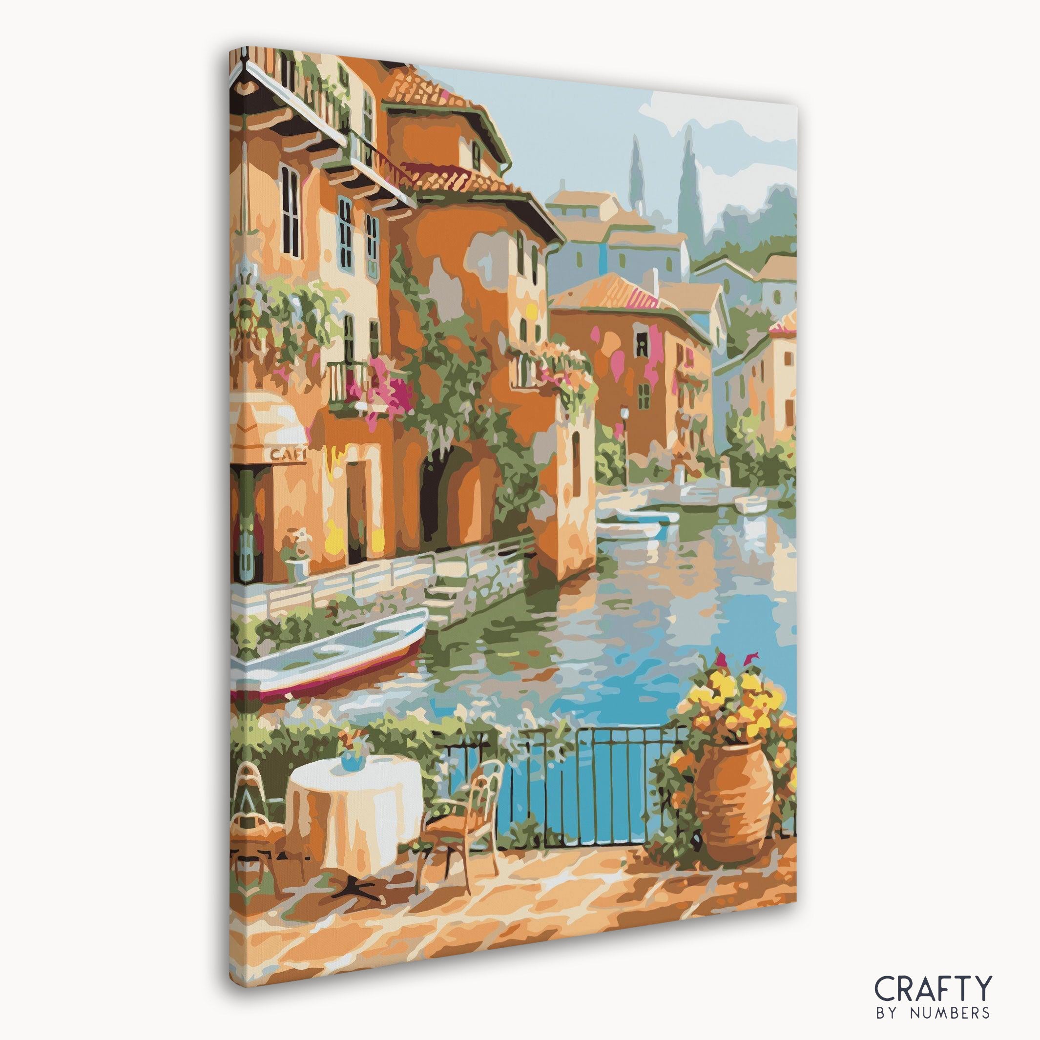 Premium wooden paint brushes arranged beside Mediterranean Harbor canvas.