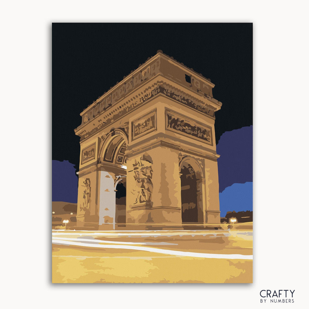 A paint by numbers kit featuring a night view of the Arc de Triomphe, with the option to frame or not frame the canvas.