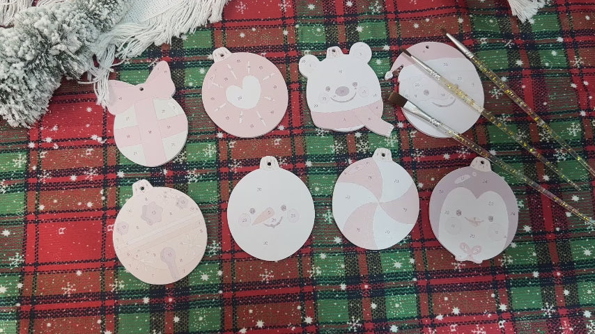 Load video: Christmas tree decorated with Polar Cheer Collection ornaments in bright, playful winter patterns.