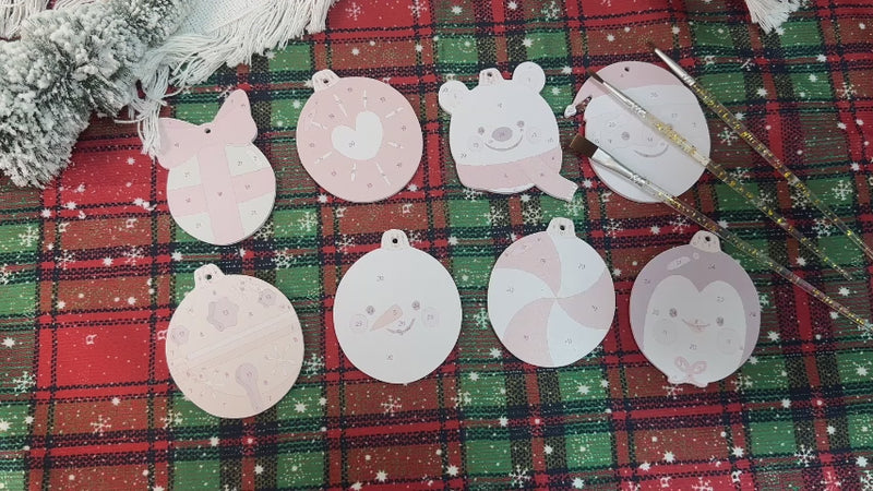 Christmas tree decorated with Polar Cheer Collection ornaments in bright, playful winter patterns.