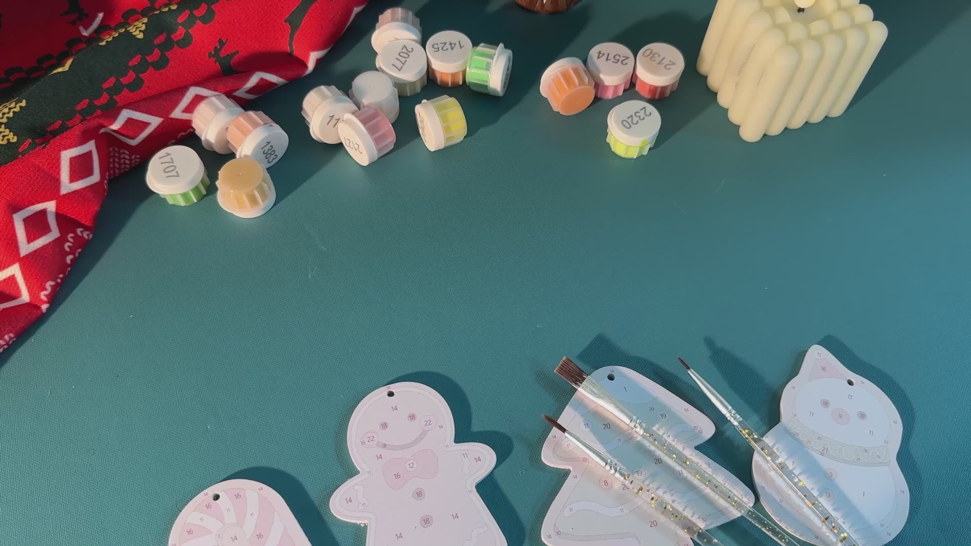 Load video: Festive alphabet ornaments with glitter and holiday designs for Christmas décor.