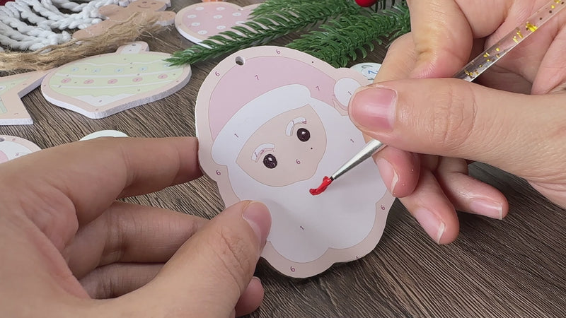 Assorted Santa-inspired ornaments with red, white, and green holiday colors.