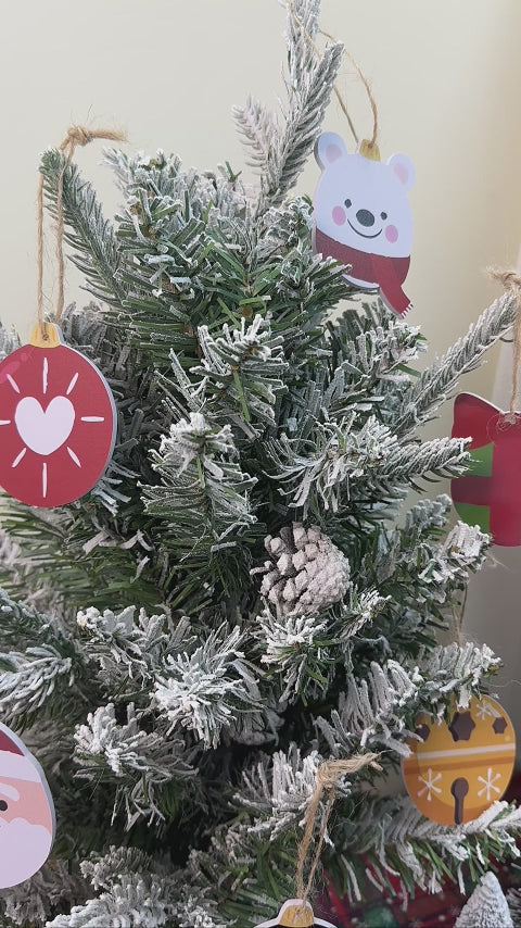 Set of holiday-themed Polar Cheer Collection ornaments with cheerful polar bears and snowflakes.