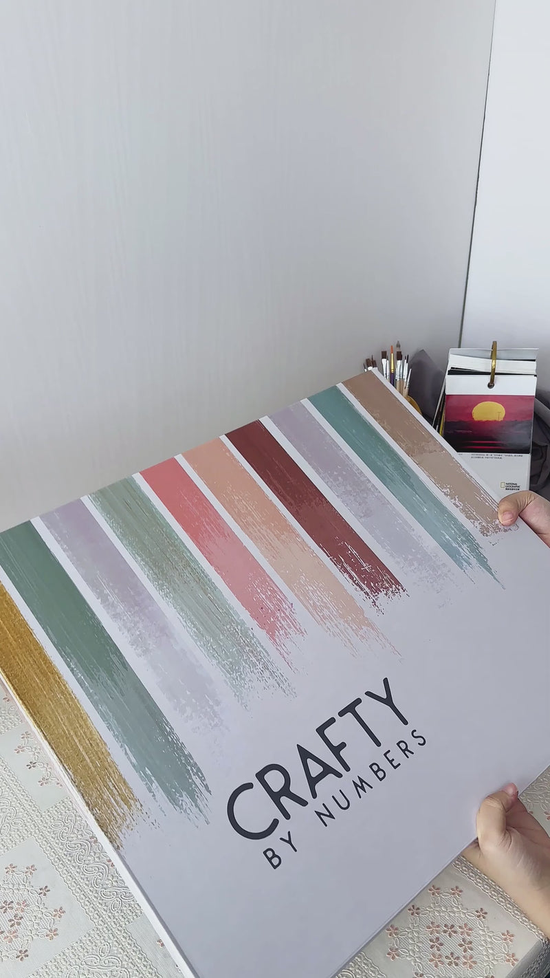 Paint by numbers kit featuring a serene mountain landscape at sunset