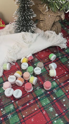 Polar Cheer Collection Christmas ornaments featuring festive designs, including polar bears, penguins, and holiday motifs in vibrant colors, perfect for decorating a Christmas tree.